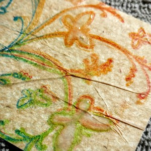 crayons, tissue paper, a stamp and a glue stick, then filled in a couple of butterflies with white glue and let it dry... gentle texture